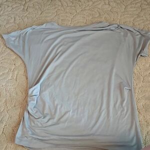 Atheltica light green shirt that raises up on the side.  Size M